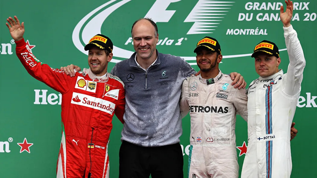 Lewis Hamilton of Great Britain and Mercedes GP celebrates on the podium with Sebastian Vettel of Germany and Ferrari and Valtteri Bottas of Finland and Williams during the Canadian Formula One Grand Prix at Circuit Gilles Villeneuve on June 12, 2016 in Montreal, Canada.