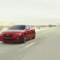 ruby red metallic subaru impreza sedan concept front three quarters road