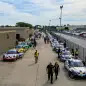 GT3 Cup cars wait in Gasoline Alley at the Indy Motor Speedway