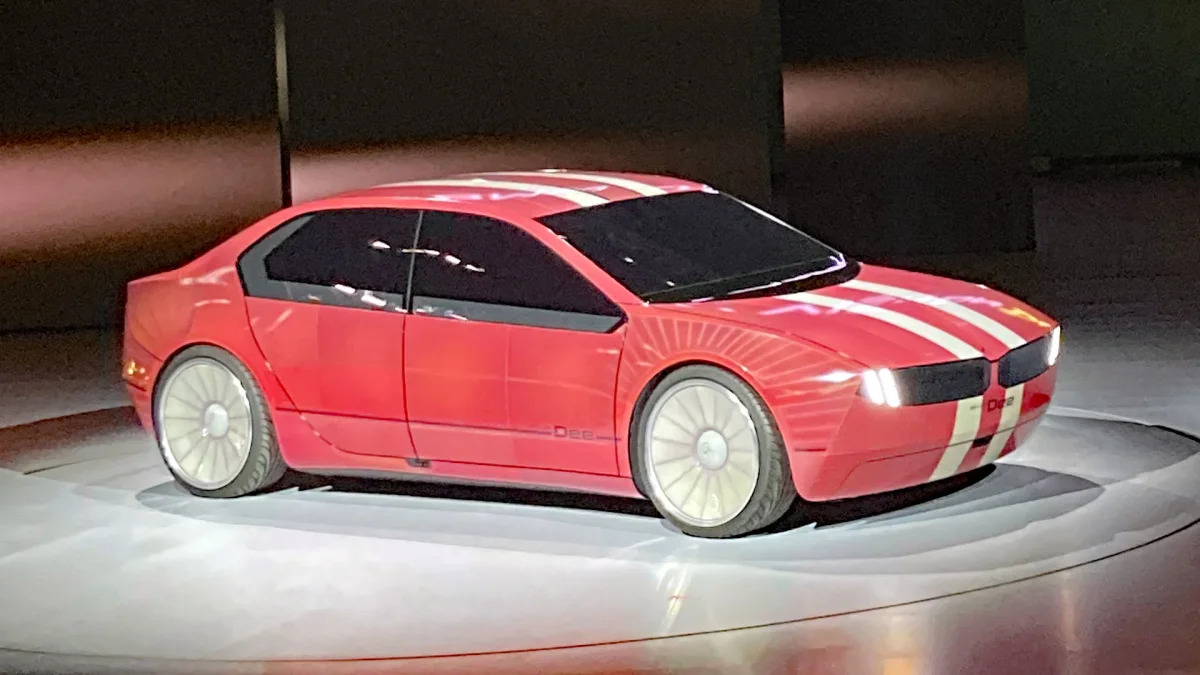 BMW i Vision Dee on stage in red with racing stripes