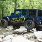 Project Trail Force 2015 Jeep Wrangler Rubicon traversing rocks.