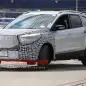 camouflaged silver ford escape spy shots front three quarters