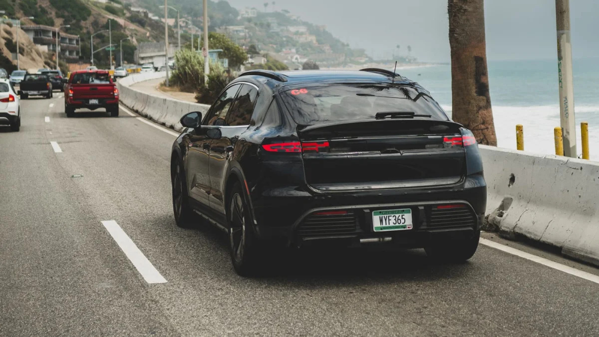 2024 Porsche Macan Electric action rear in traffic
