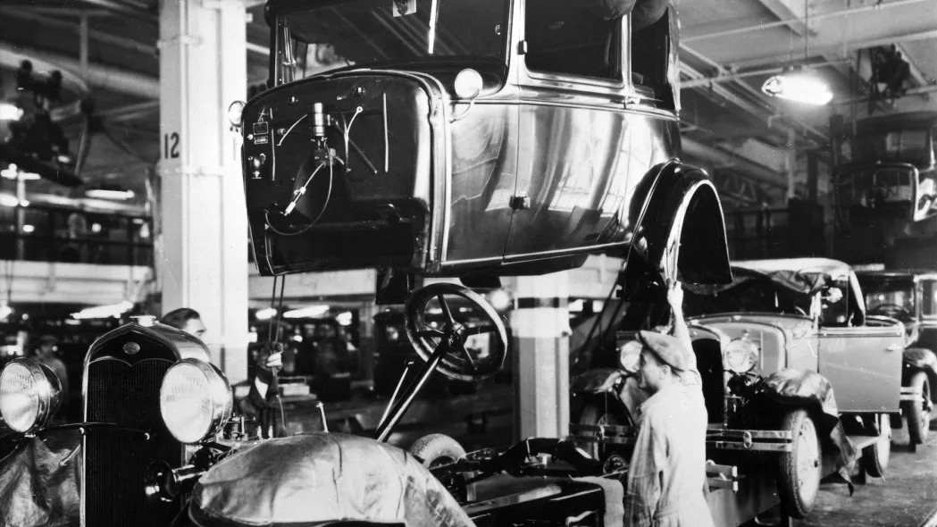 Assembly line production of the Model A at a Ford automobile plant in Detroit, Michigan, 1927.