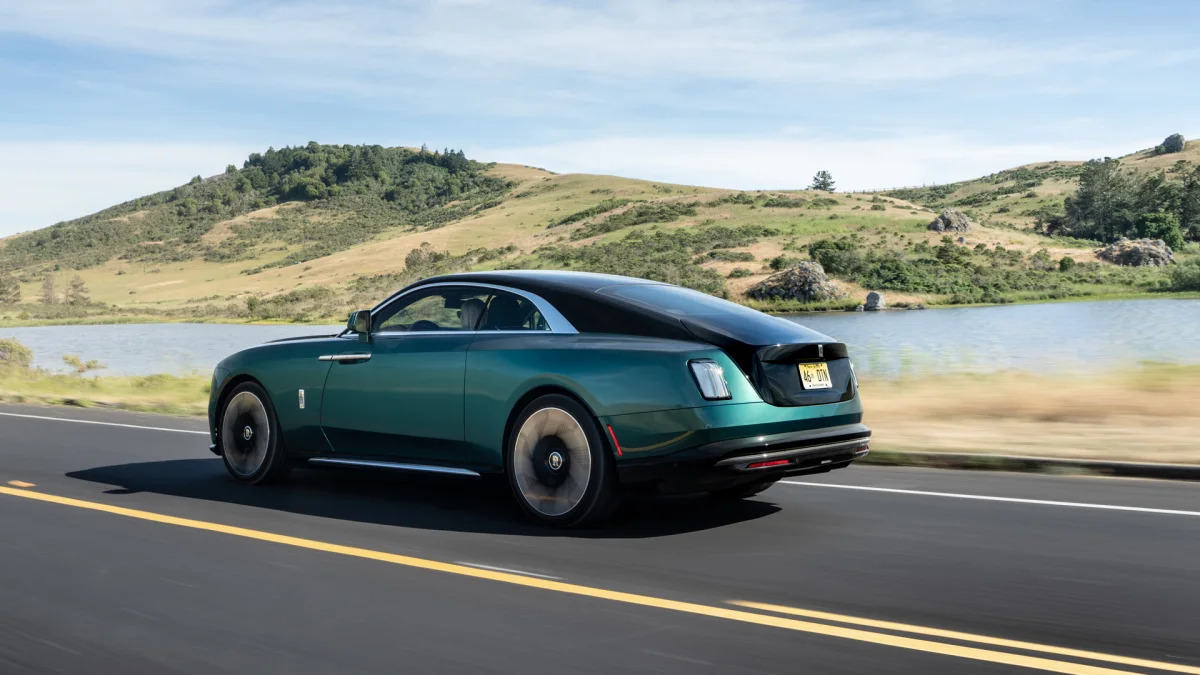 2024 Rolls-Royce Spectre in Imperial Jade action rear profile