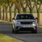 2024 Range Rover Velar action front with some trees